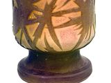 a vase with a design on it on a white background