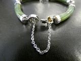 silver and green bracelet with a chain and clasp