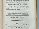 an open book on a table with a blue background