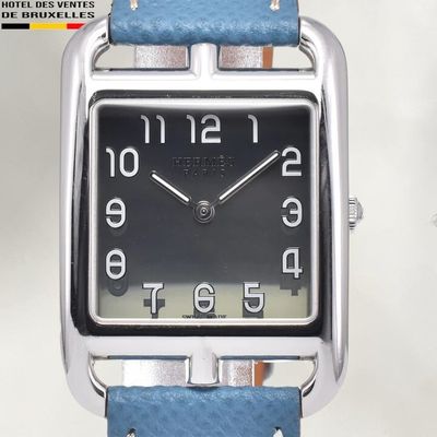a watch that is sitting on top of a blue strap