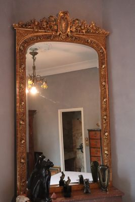 a mirror that is on a dresser in a room