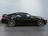 an image of a black sports car parked in a garage