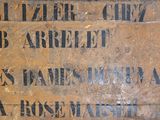 a wooden box with writing on it in a room