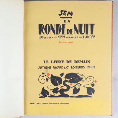 un livre ouvert sur lequel figure l'image d'un chat et d'une souris