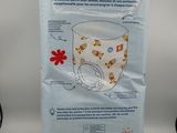 a close up of a bag of baby diapers on a table