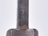 a close up picture of a hammer with a wooden handle