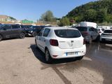 a lot of cars parked in a parking lot on a sunny day
