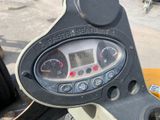 a close up of a clock on the dashboard of a motorcycle