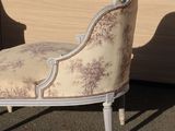 a chair that is sitting in front of a window
