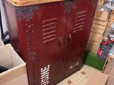 a red metal cabinet with a coffee maker on top of it