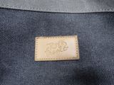 the back of a bag with a leather label on it