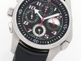 the watch is black with a red second hand and a white second hand