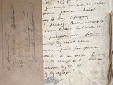a piece of paper with writing on it sitting on a table