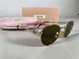 the sunglasses are sitting on a table next to a pink case