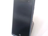 a cell phone that is sitting on top of a stand