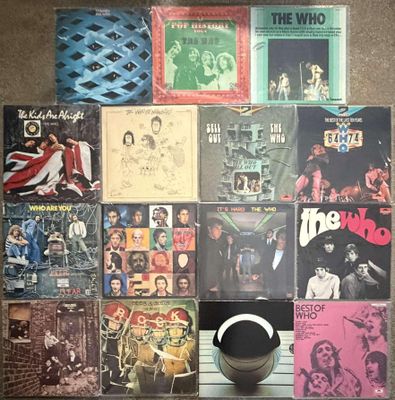 a lot of records on a table with a basketball ball
