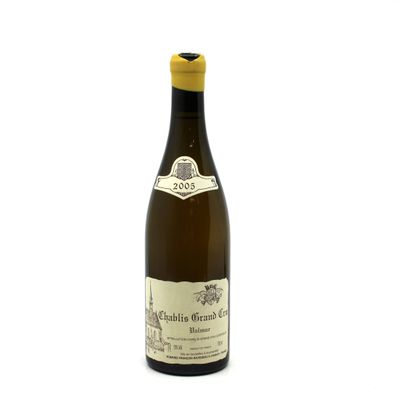 a bottle of wine that is sitting on a table