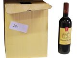 a bottle of wine next to a cardboard box with a sticker on it