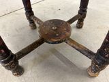 a small table with a wooden top and metal legs