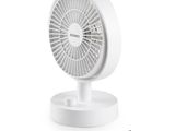 an image of a white table fan sitting on top of a white table