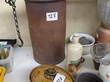 a table with a lot of pots and other items on it