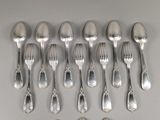 a lot of silver spoons and spoon spoons on a table