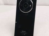 a black camera that is sitting on top of a stand
