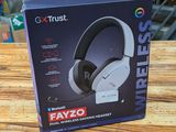 an image of a box of headphones sitting on a wooden table
