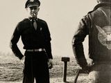 a black and white photo of two men in uniform