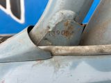 a close up of a metal object on the side of a truck