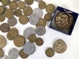 a lot of coins that are sitting on a table