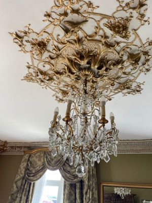 a chandelier hanging from the ceiling in a room