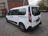 a white van that is parked in a parking lot