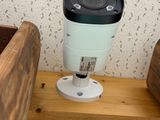 a camera that is sitting on top of a wooden table