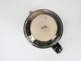 an overhead view of a coffee cup with a saucer on it