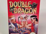 the box of the game double dragon is sitting on the table