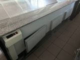 an image of a kitchen with a counter top and a dishwasher