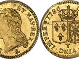 a gold sovereign coin with a crown on top of it