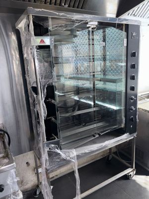 a commercial oven with a glass door in a commercial kitchen