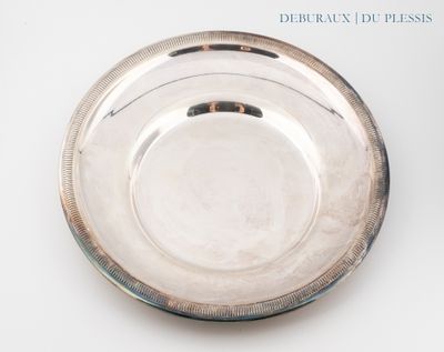 a silver plate that is sitting on a table