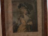 painting of a woman in a hat and dress in a wooden frame