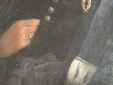 portrait of a man in a black coat holding a cup of coffee