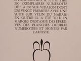 the back of a book with a black and white image of an apple