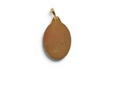 a close up of a gold plated pendant on a white background