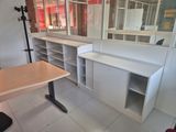 a room with a desk and a mirror in it