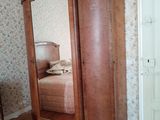 an image of a bedroom with a large wooden armoire