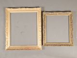 pair of antique gold picture frames on a gray wall