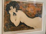a painting of a woman laying down on a bed