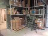 many boxes on the shelves in the warehouse