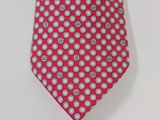 an image of a red and white tie hanging on a wall
